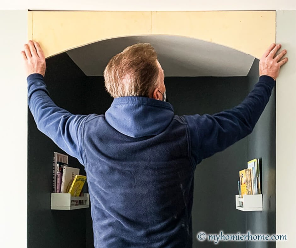 DIY archway unfinished held at the ceiling