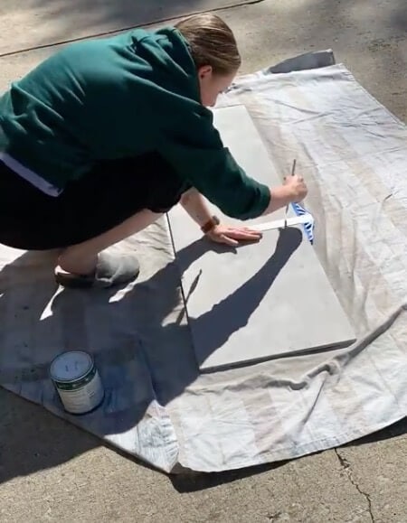 Looking for a personalized DIY porch sign for fall? Here's how using a piece of wood, spray paint, and some paint markers. Read more here.