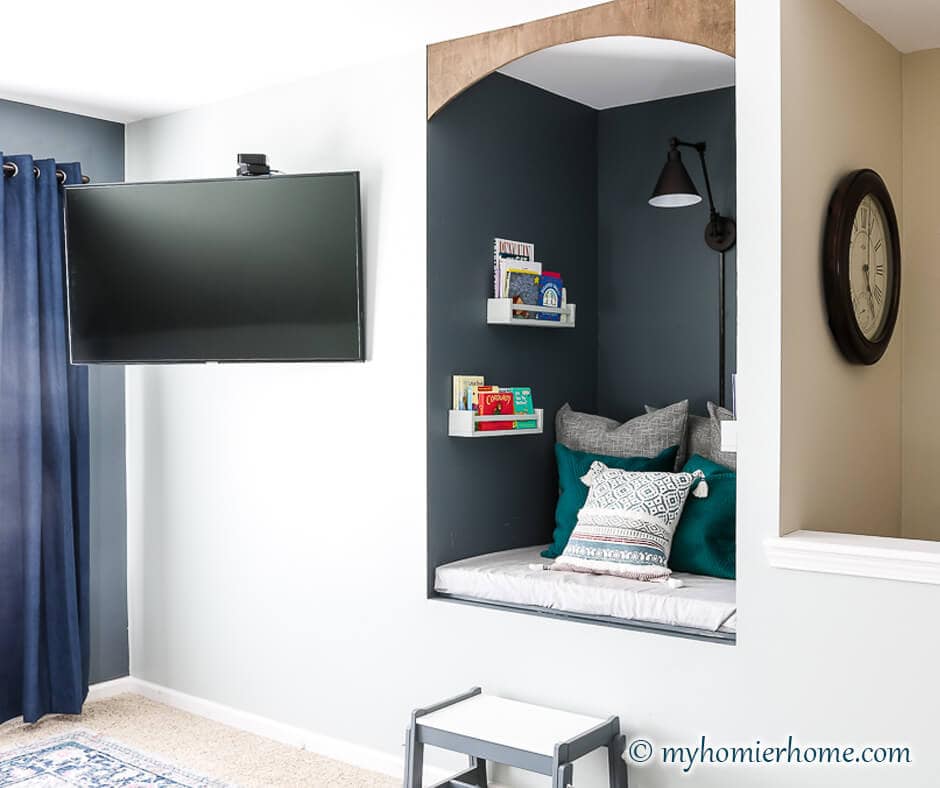 Not sure what to do with that awkward old TV cutout in your wall? Repurpose it fora DIY reading nook! It'll make the cutest place to read for all!