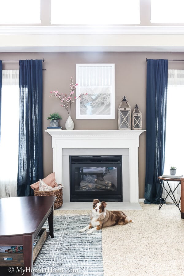 How far we've come in this living room! This fireplace surround used to be a gross beige. Now it is a beautiful light gray!