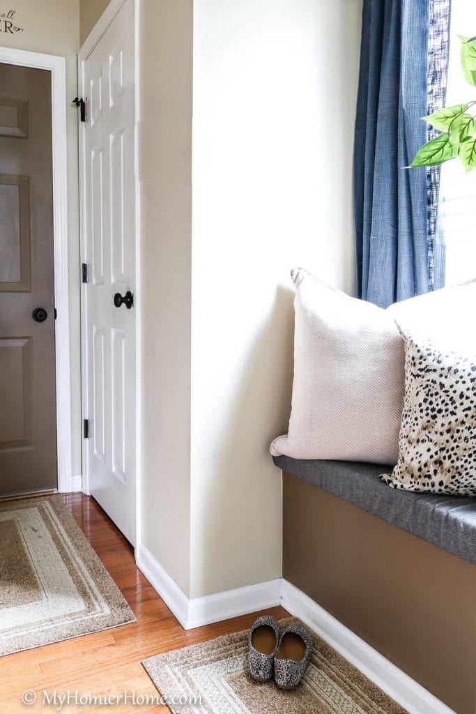 Learn how I transformed my tiny entryway window seat into a beautiful and functional space.