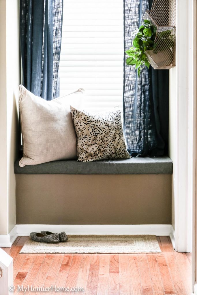 Learn how I transformed my tiny entryway window seat into a beautiful and functional space.