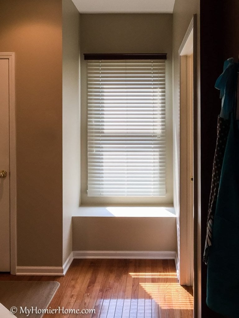 Learn how I transformed my tiny entryway window seat into a beautiful and functional space.