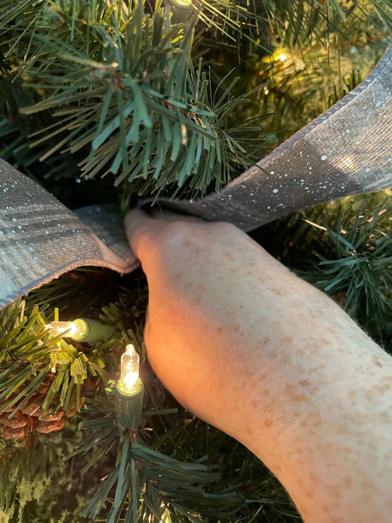 add ribbon to your skinny tree by tucking in one end and creating a loop