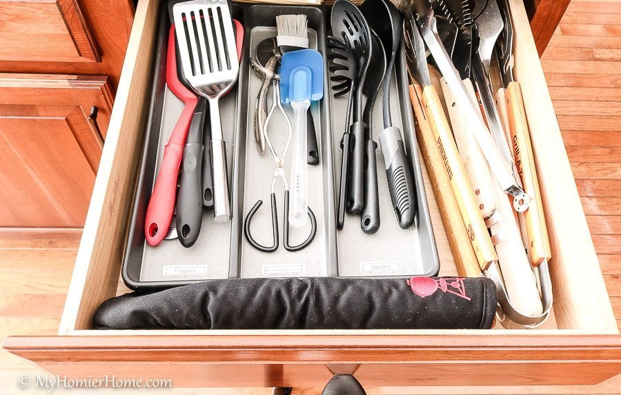 How to organize your kitchen cabinets using clear and simple strategies to tackle kitchen cabinet dysfunction without losing your mind. The extra utensil drawer after is so much better!