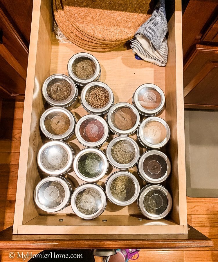 How to organize your kitchen cabinets using clear and simple strategies to tackle kitchen cabinet dysfunction without losing your mind. Spices drawer before