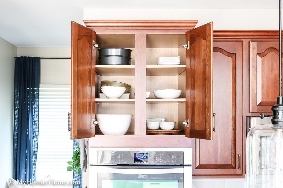 How to organize your kitchen cabinets using clear and simple strategies to tackle kitchen cabinet dysfunction without losing your mind - Above the stove (after)