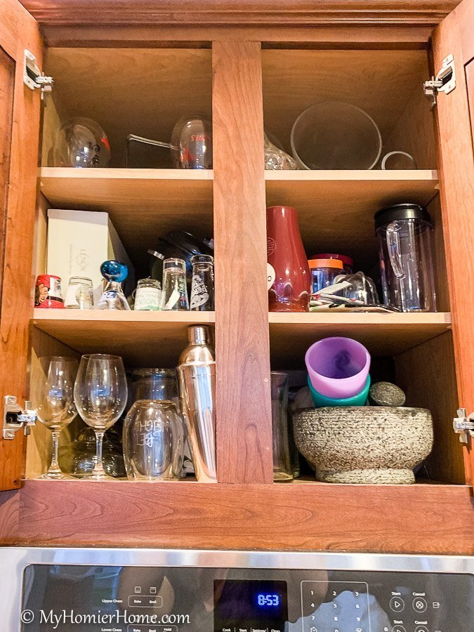 How to organize your kitchen cabinets using clear and simple strategies to tackle kitchen cabinet dysfunction without losing your mind. Above stove before