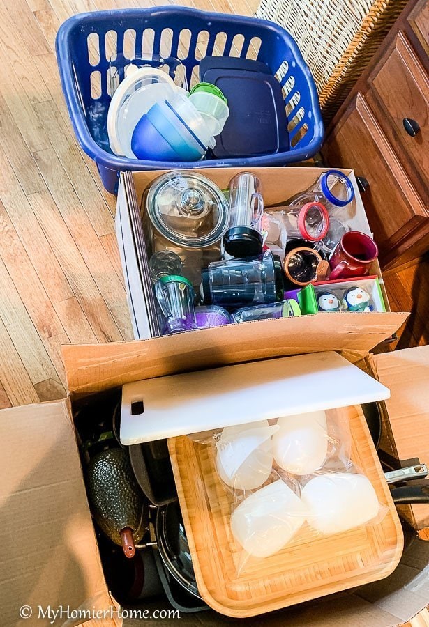 How to organize your kitchen cabinets using clear and simple strategies to tackle kitchen cabinet dysfunction without losing your mind. Be sure to have at least a few boxes handy for items you will donate.