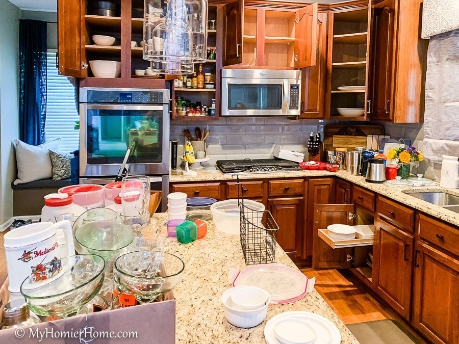 Use separate boxes to house items that belong in another room. How to organize your kitchen cabinets using clear and simple strategies to tackle kitchen cabinet dysfunction without losing your mind.