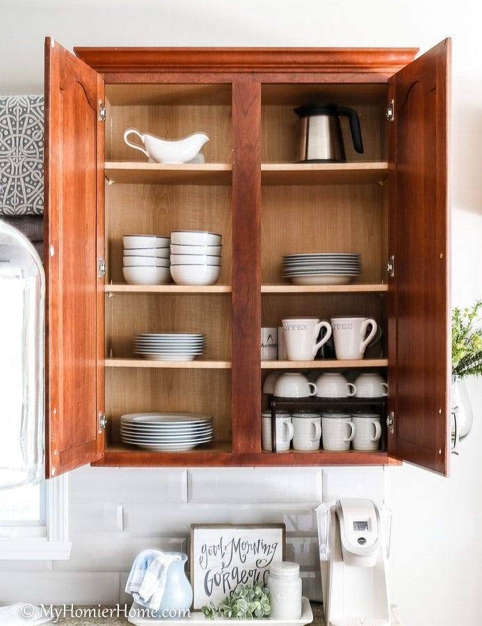 How to organize your kitchen cabinets using clear and simple strategies to tackle kitchen cabinet dysfunction without losing your mind. Doesn't the after look so much better? Plates are easily accessible and the mugs are easy to grab and go near the coffeemaker.