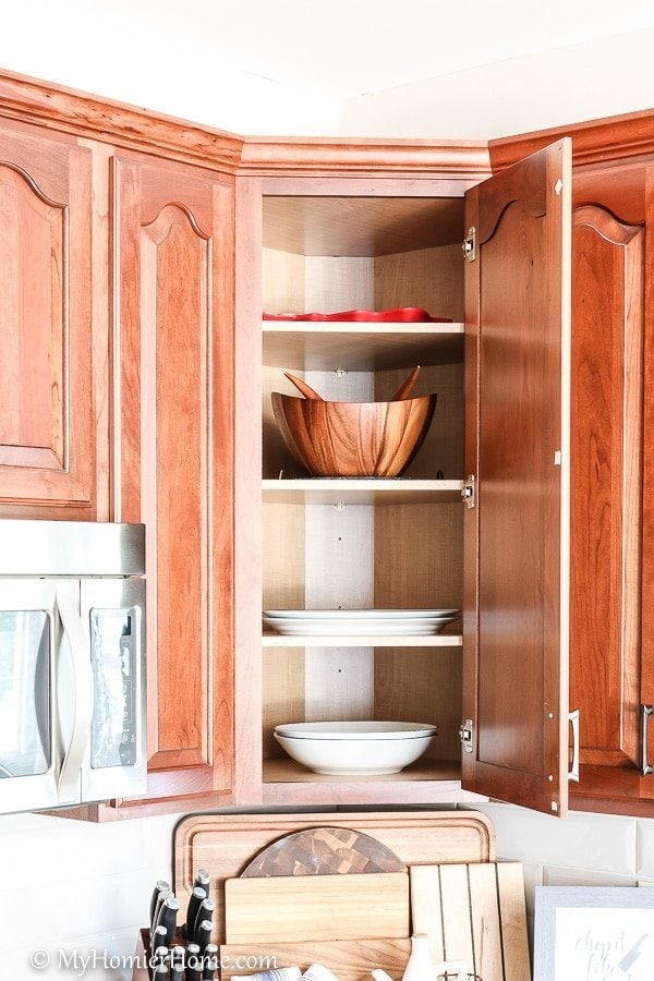 How to organize your kitchen cabinets using clear and simple strategies to tackle kitchen cabinet dysfunction without losing your mind.