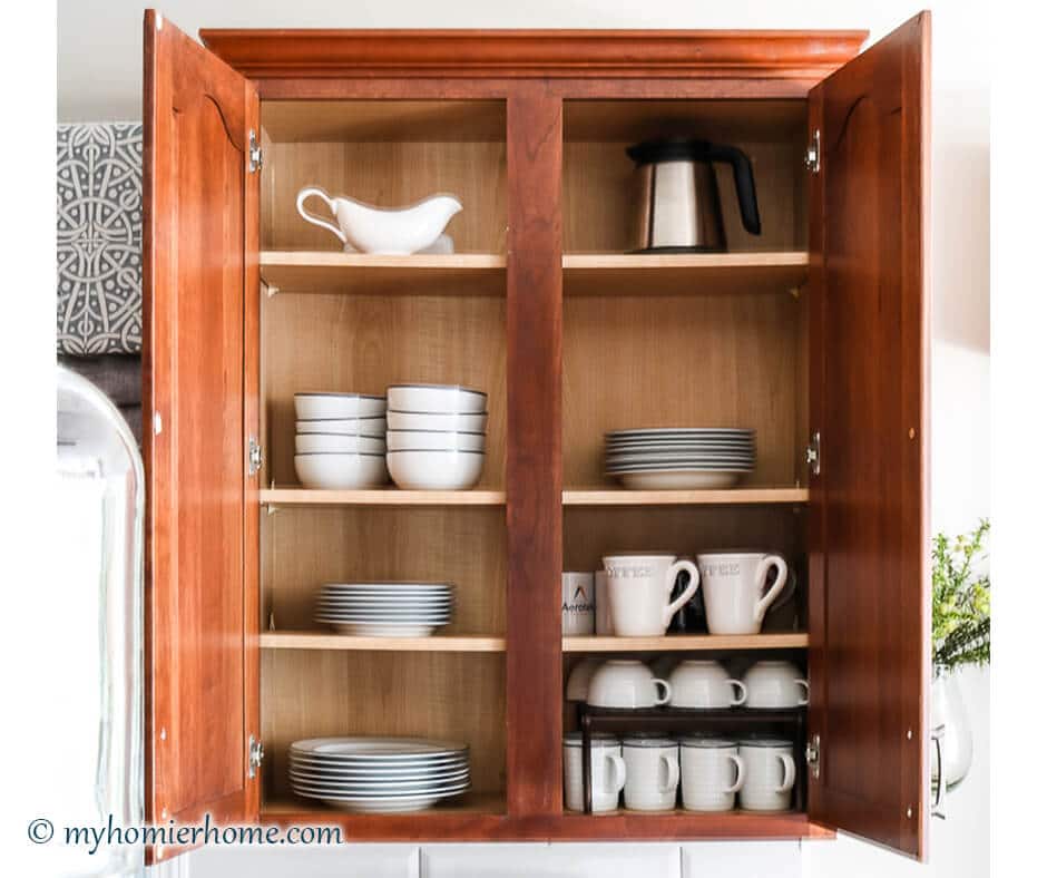 How to organize your kitchen cabinets using clear and simple strategies to tackle kitchen cabinet dysfunction without losing your mind.