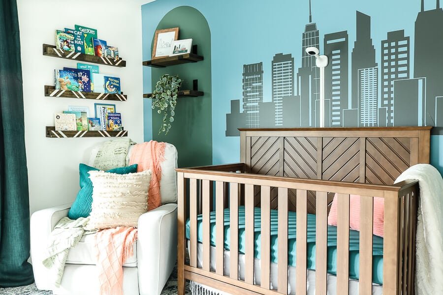 Nursery Bookshelves with books and crib view